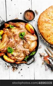 Baked chicken with potatoes. Grilled chicken cooked in pan with spices according to the Georgian recipe