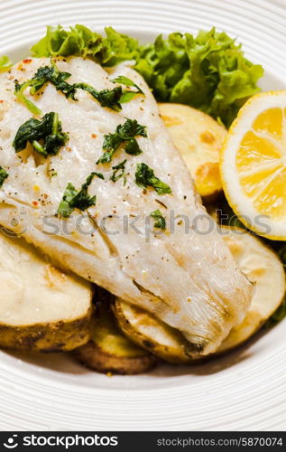 Baked cod fillet on rustic potato pillow