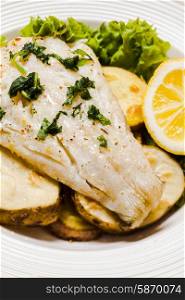Baked cod fillet on rustic potato pillow