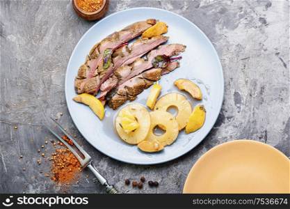 Baked duck breast with pineapple sauce.Grilled duck breast slices. Delicious roasted duck