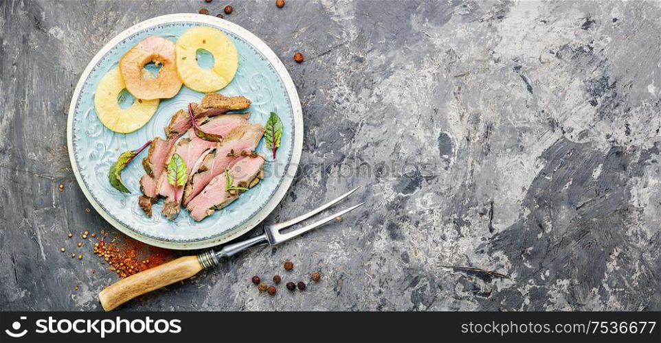 Baked duck breast with pineapple sauce.Grilled duck breast slices. Roasted duck with pineapple