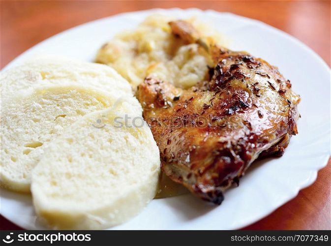 Baked Duck Leg with Dumplings and Stewed White Cabbage.