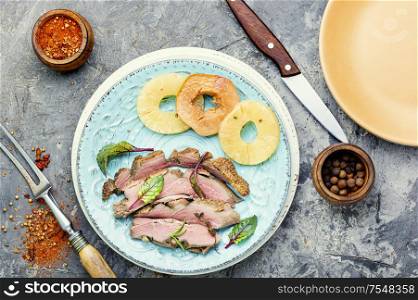 Baked duck meat with pineapple sauce.Fried duck breast. Roasted duck with ananas