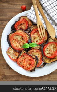 Baked eggplant with tomatoes as tasty vegetarian pizza topping, traditional italian food, organic nutrition