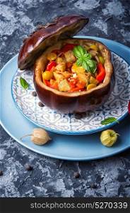 baked eggplant with vegetables. autumn baked eggplant stuffed with vegetables and spices