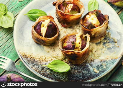 Baked figs with cheese and bacon. Festive autumn snack.. Figs baked in meat bacon, fall recipe