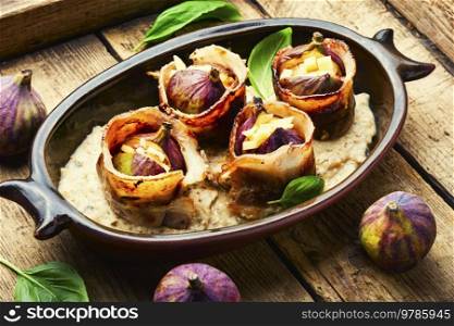 Baked figs with cheese and bacon. Festive autumn snack.. Figs baked in meat bacon