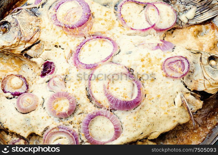 Baked fish in sour cream sauce to the Christmas table.Fish food.. Baked fish for christmas