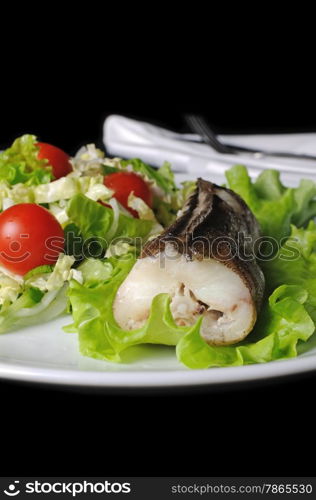 Baked fish (King clip) with a salad of green vegetables and cherry tomatoes