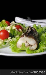 Baked fish (King clip) with a salad of green vegetables and cherry tomatoes