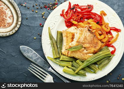 Baked fish with okra and red pepper.Fish grenadier. Baked fish with vegetables