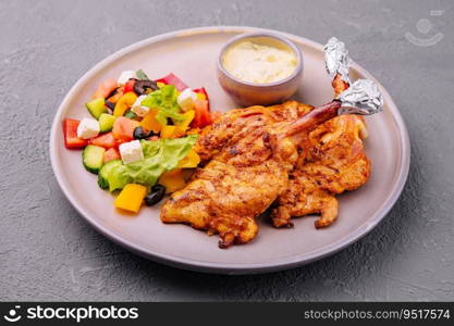 baked golden chicken drumsticks and Greek salad