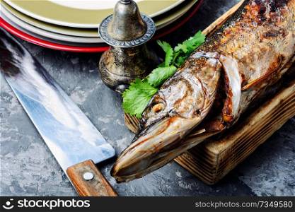 Baked grilled fish.Pike fish stuffed with mushrooms.Pike royally. Russian cuisine. Pike stuffed with vegetables