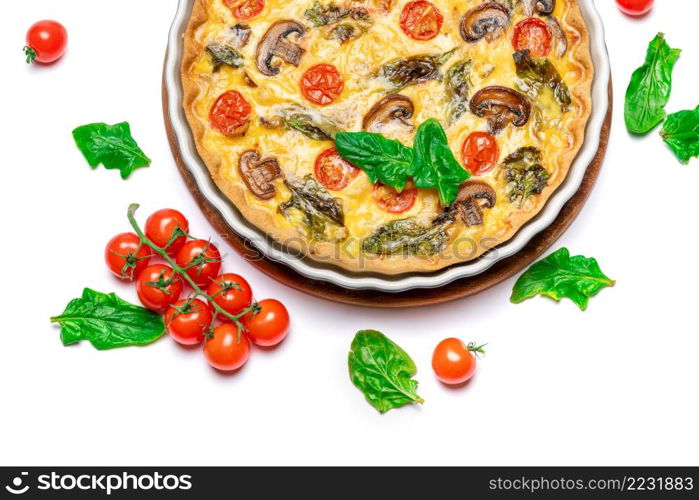 Baked homemade quiche pie with tomato, chcken and mushrooms in ceramic baking form. Baked homemade quiche pie in ceramic baking form