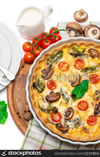 Baked homemade quiche pie with tomato, chcken and mushrooms in ceramic baking form. Baked homemade quiche pie in ceramic baking form