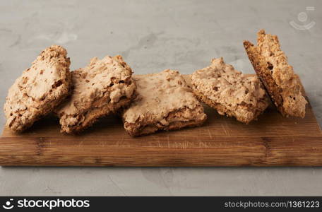 baked Krakow meringue cookies on a wooden board, delicious dessert of whipped egg whites and almond flour