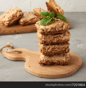 baked Krakow meringue cookies on a wooden board, delicious dessert of whipped egg whites and almond flour