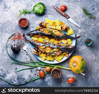 Baked mackerel in leek leaves.Fish with pumpkin filling.Seafood. Baked fish with pumpkin filling