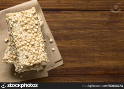 Baked marshmallow, popped quinoa and coconut bars, photographed overhead with natural light (Selective Focus, Focus on the bar on the top)