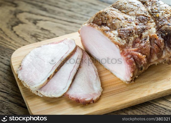 Baked meat on the wooden board