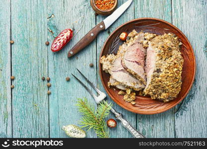 Baked meat under bread crust.Roasted beef.Space for text. Baked meat for Christmas