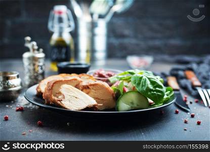baked meat with salad, diet food, meat and salad on plate
