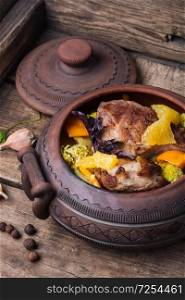 Baked meat with vegetables in clay pots. Rural recipe meat