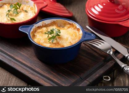 Baked mushroom julienne with chicken and cheese in pots. Chicken Stew with Cheese Baked in Pot