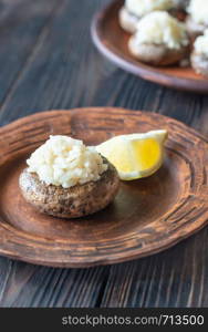 Baked mushrooms stuffed with risotto