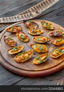Baked mussels stuffed with cheddar cheese sauce