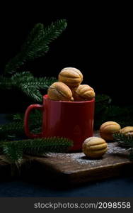 baked nut-shaped dessert in a red ceramic mug