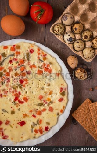 baked omelette with different eggs and vegetables with rye small load of bread. baked omelette food