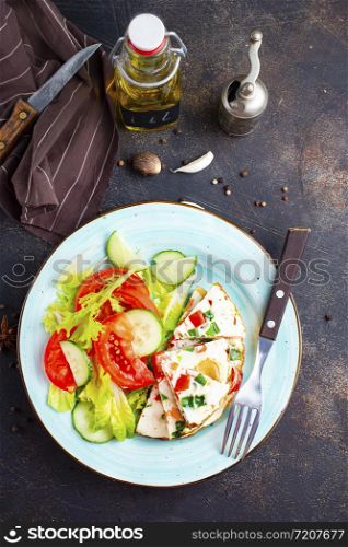 baked omelette with pepper and onion on white plate