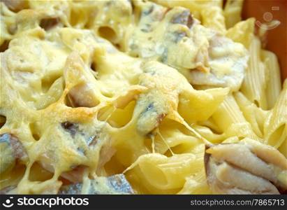 Baked pasta penne with mackerel and cheese