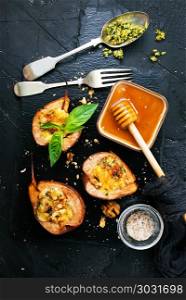 baked pears . baked pears with cheese nuts honey, stock photo