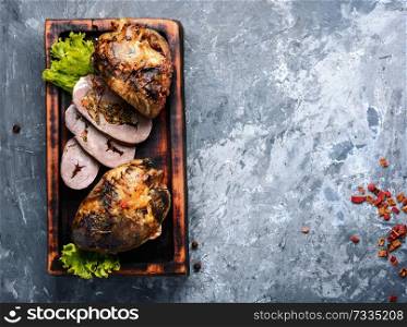 Baked pork heart stuffed with mushrooms and herbs.American cuisine concept. Slices of pork heart