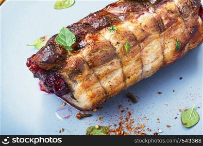 Baked pork meat stuffed with cherries.Baked pork.. Baked pork meat with cherry