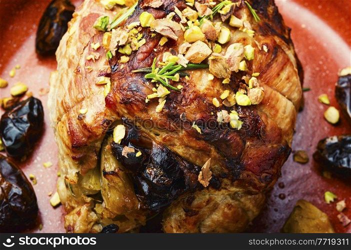 Baked pork with dates, apples and pistachios. Roasted lean pork.. Meatloaf with dates and apples
