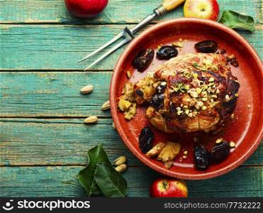 Baked pork with dates, apples and pistachios. Roasted lean pork.. Meatloaf with dates and apples