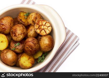 Baked potato in a clay pot isolated on white background. High quality photo. Baked potato in a clay pot isolated on white background