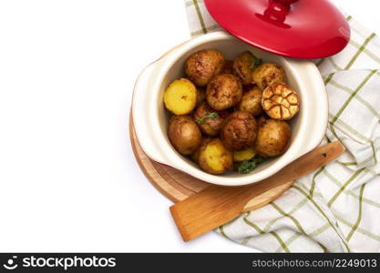 Baked potato in a clay pot isolated on white background. High quality photo. Baked potato in a clay pot isolated on white background