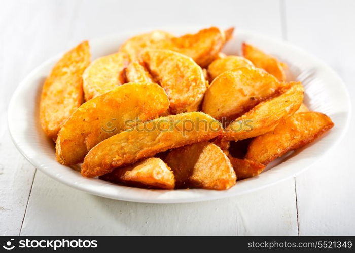 baked potato in a plate on wooden table