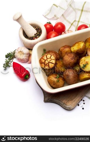 Baked potato in baking dish pot isolated on white background. High quality photo. Baked potato in baking dish pot isolated on white background