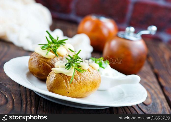 baked potato on plate and on a table
