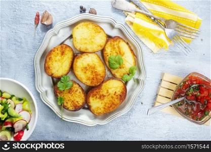 baked potato with salt and spice on plate