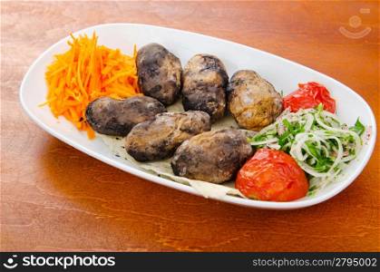 Baked potatoes in the plate