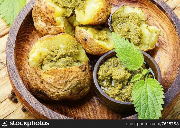 Baked potatoes stuffed with herbs and nettle leaves. Baked unpeeled potatoes