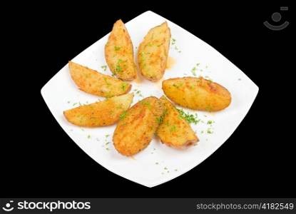 Baked potatoes with greens on a black background