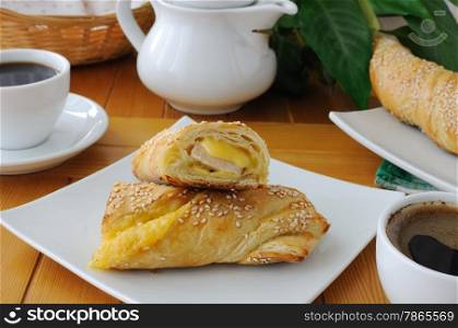 baked puff pastry with sesame, ham and cheese