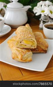 baked puff pastry with sesame, ham and cheese